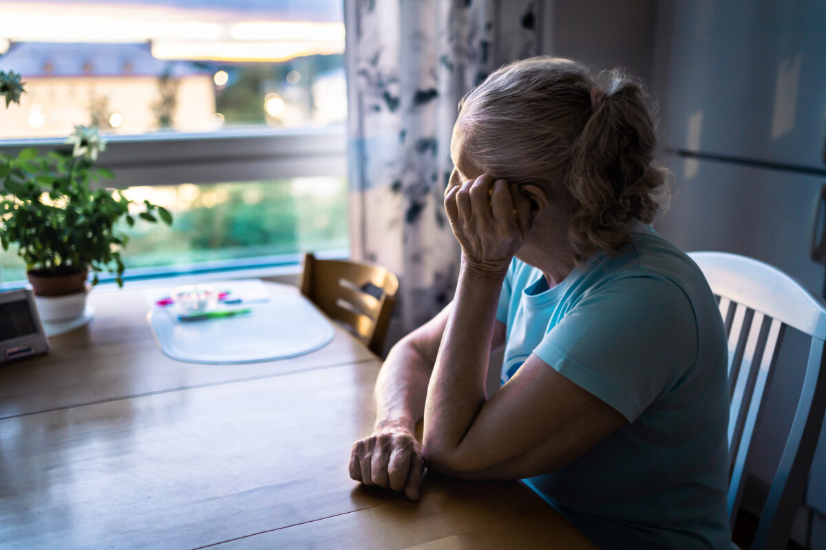 sad woman looking out of window